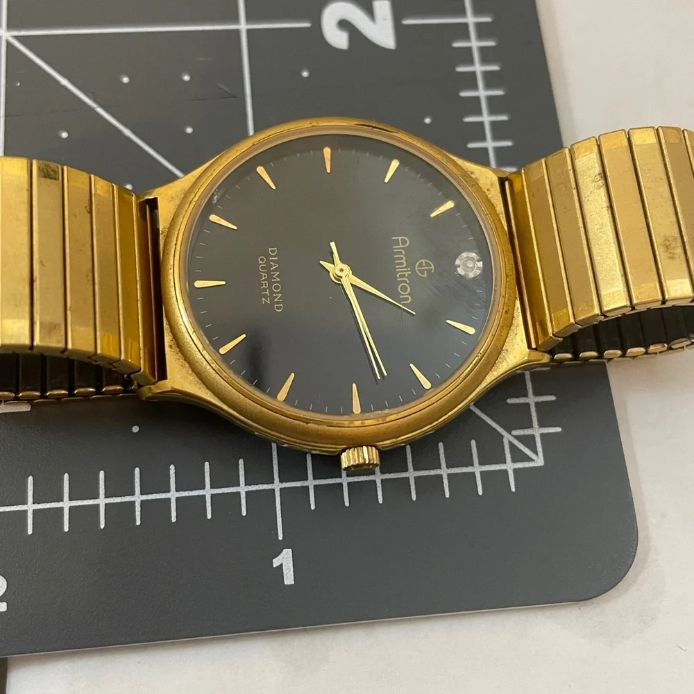 Armitron Gold Tone Watch w/ Black Dial and Single Diamond Accent needs battery